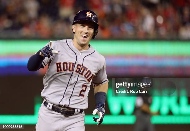 Alex Bregman of the Houston Astros and the American League celebrates as he rounds the bases after hitting a solo home run in the tenth inning...