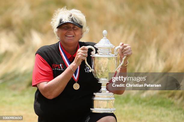 Laura Davies of England poses with the U.S. Senior Women's Open trophy after winning in the final round at Chicago Golf Club on July 15, 2018 in...