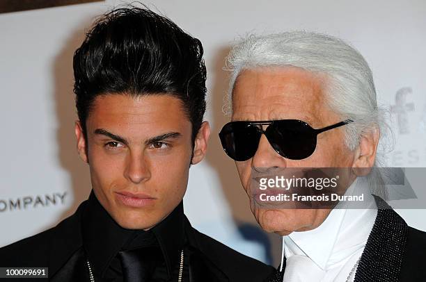 Baptiste Giabiconi and Karl Lagerfeld arrive at amfAR's Cinema Against AIDS 2010 benefit gala at the Hotel du Cap on May 20, 2010 in Antibes, France.