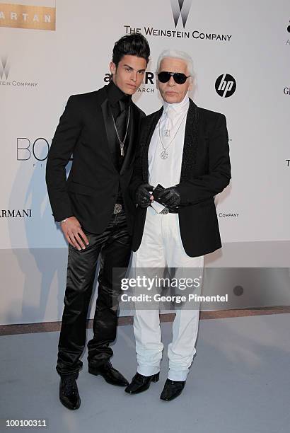 Baptiste Giabiconi and Karl Lagerfeld attend amfAR's Cinema Against AIDS Gala at the Hotel Du Cap during the 63rd International Cannes Film Festival...