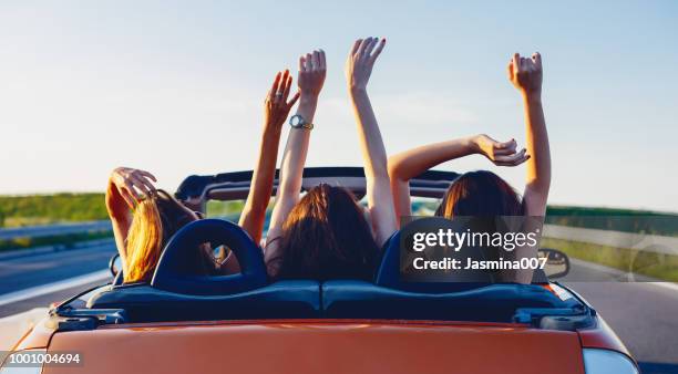 young women on a road trip with cabriolet - three people in car stock pictures, royalty-free photos & images