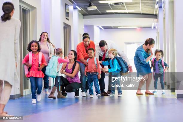 preschool students and parents, first day of school - family meeting stock pictures, royalty-free photos & images