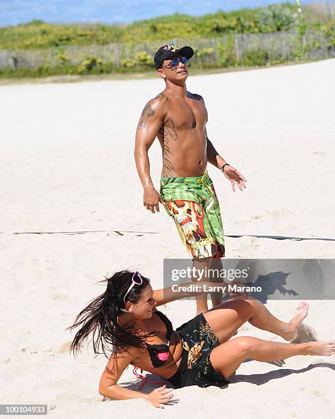 Pauly D Delvecchio and Jenni 'J Wow' Farley are seen playing Vollyball on May 20, 2010 in Miami Beach, Florida.