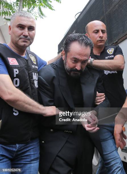 Televangelist Adnan Oktar and other suspects are brought to the Haseki Training and Research Hospital May 29 Additional Service Building in order to...