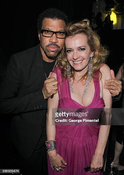 Musician Lionel Richie and Chopar Co-President Caroline Gruosi-Scheufele attend the Artists for Peace and Justice Fundraiser at the VIP Room, Palm...