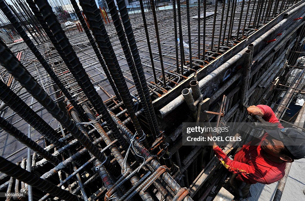 A construction worker arranges steelbars