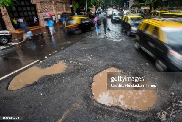 Potholes outside Dadar station , on July 17, 2018 in Mumbai, India. The potholed roads in Mumbai and its surrounding areas have led to several road...
