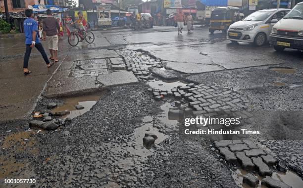 Huge Potholes on Jogeshwari- Vikhroli Link Road at Jogeshwari, on July 17, 2018 in Mumbai, India. The potholed roads in Mumbai and its surrounding...