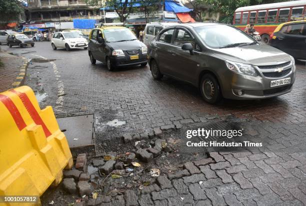 Pothole at Sant Gadge Maharaj Chowk at Saat Rastha, on July 17, 2018 in Mumbai, India. The potholed roads in Mumbai and its surrounding areas have...