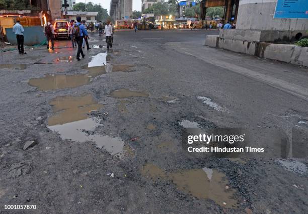 Huge potholes on WEH under Andheri bridge, on July 17, 2018 in Mumbai, India. The potholed roads in Mumbai and its surrounding areas have led to...