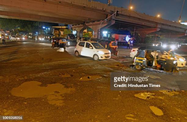 Huge potholes on WEH under Jogeshwari, on July 17, 2018 in Mumbai, India. The potholed roads in Mumbai and its surrounding areas have led to several...