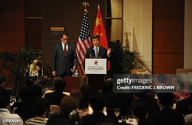 Secretary of Commerce Gary Locke gestures while speaking at a business luncheon in Beijing on May 21, 2010. Locke is on the final stop of a...