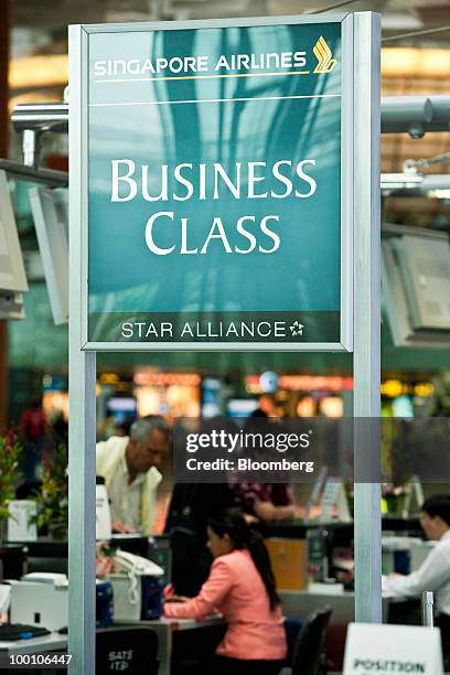 Business class passengers check-in for a Singapore Airlines Ltd. Flight at Changi Airport in Singapore on Friday, May 21, 2010. Singapore Airlines...