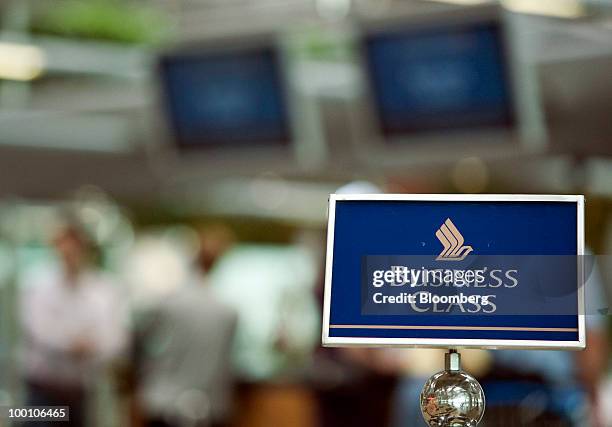 Business class passengers check in for a Singapore Airlines Ltd. Flight at Changi Airport in Singapore on Friday, May 21, 2010. Singapore Airlines...