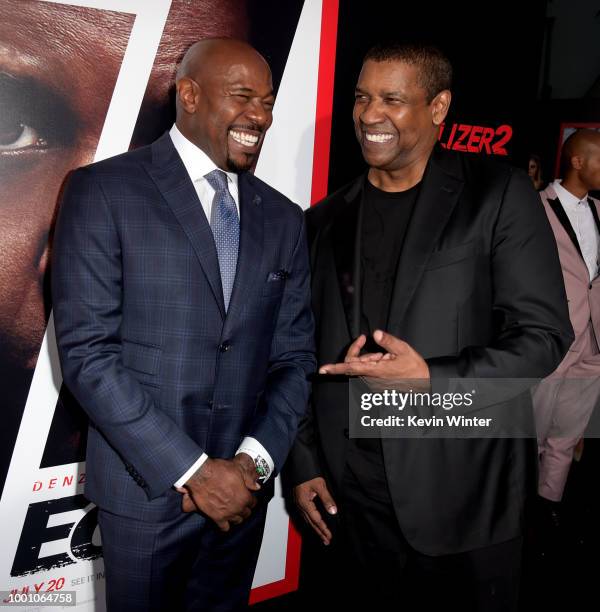 Director Antoine Fuqua and actor Denzel Washington arrive at the premiere of Columbia Picture's "Equalizer 2" at the Chinese Theatre on July 17, 2018...