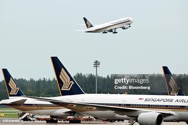 Singapore Airlines Ltd. Aircraft takes off at Changi Airport in Singapore on Friday, May 21, 2010. Singapore Airlines Ltd. Will announce earnings...