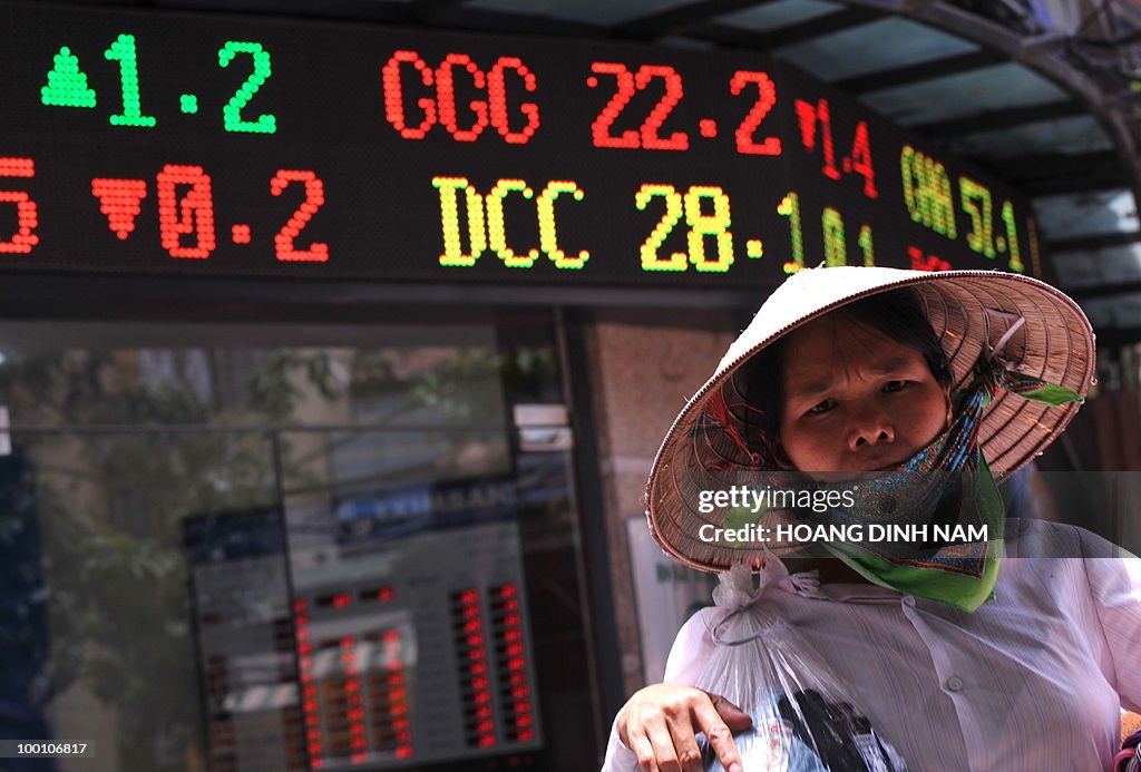 A street vendor walks past a local secur