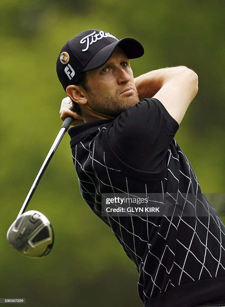 French golfer Gregory Bourdy watches his