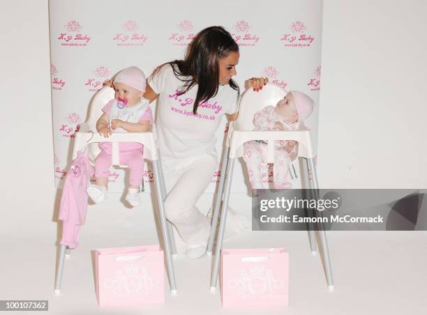 Katie Price attends photocall to launch her new range of Baby Clothes - KP BABY on May 20, 2010 in London, England.