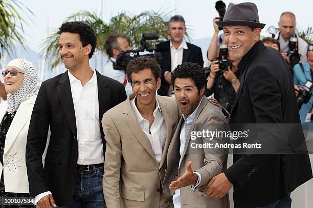 Sami Bouajila, Director Rachid Bouchareb, Jamel Debbouze and Roschdy Zem attend the 'Outside Of The Law' Photocall at the Palais des Festivals during...