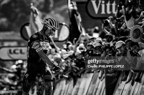 France's Julian Alaphilippe celebrates as he crosses the finish line to win the tenth stage of the 105th edition of the Tour de France cycling race...