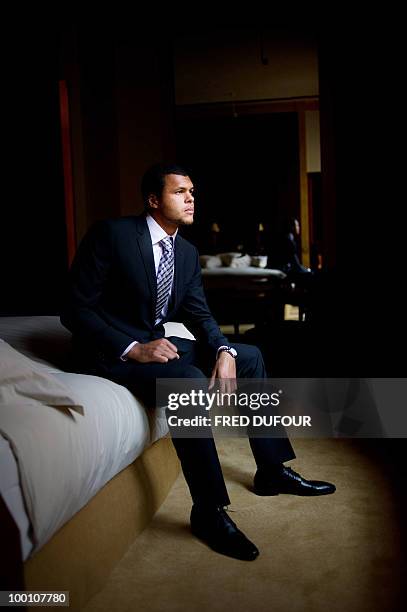 French tennis player Jo-Wilfrid Tsonga poses on May 20 in a Paris hotel prior to a charity auction for Attrap'la balle and Mecenat Chirurgie...