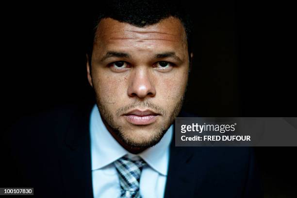 French tennis player Jo-Wilfrid Tsonga poses on May 20 in a Paris hotel prior to a charity auction for Attrap'la balle and Mecenat Chirurgie...