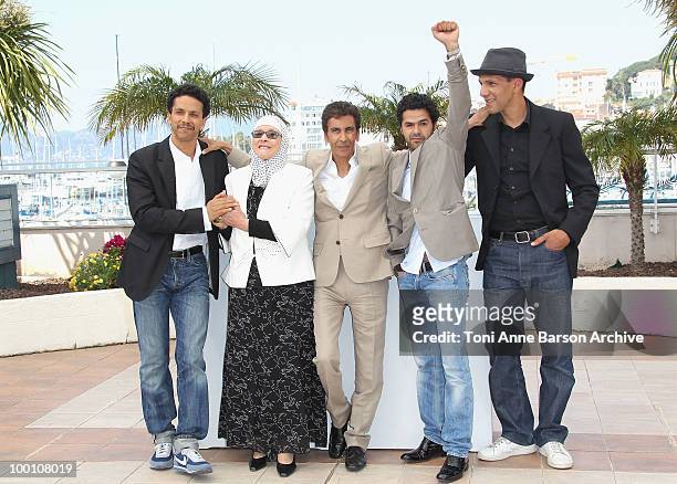 Sami Bouajila, Chafia Boudraa, Director Rachid Bouchareb, Jamel Debbouze and Roschdy Zem attend the 'Outside the Law' Photo Call held at the Palais...