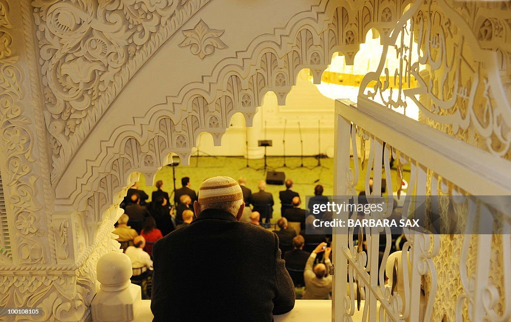 A man watches from a gallery of the new