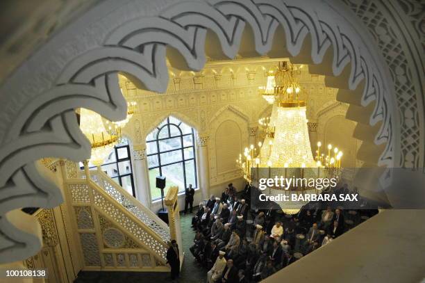 Visitors attend a service to inaugurate the new Omar Mosque in Berlin's Kreuzberg district during the inauguration of the Islamic Maschari Centre on...