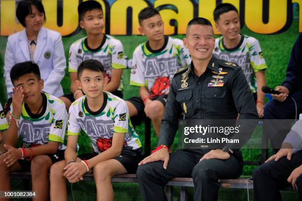 Twelve boys from the "Wild Boars" soccer team and a Thai Navy SEAL speak during a press conference for the first time since they were rescued from a...