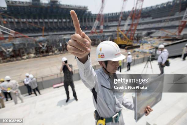 Organizer explained the progress in construction site for the Tokyo 2020 Olympic new National Stadium construction media tour on July 18, 2018 in...