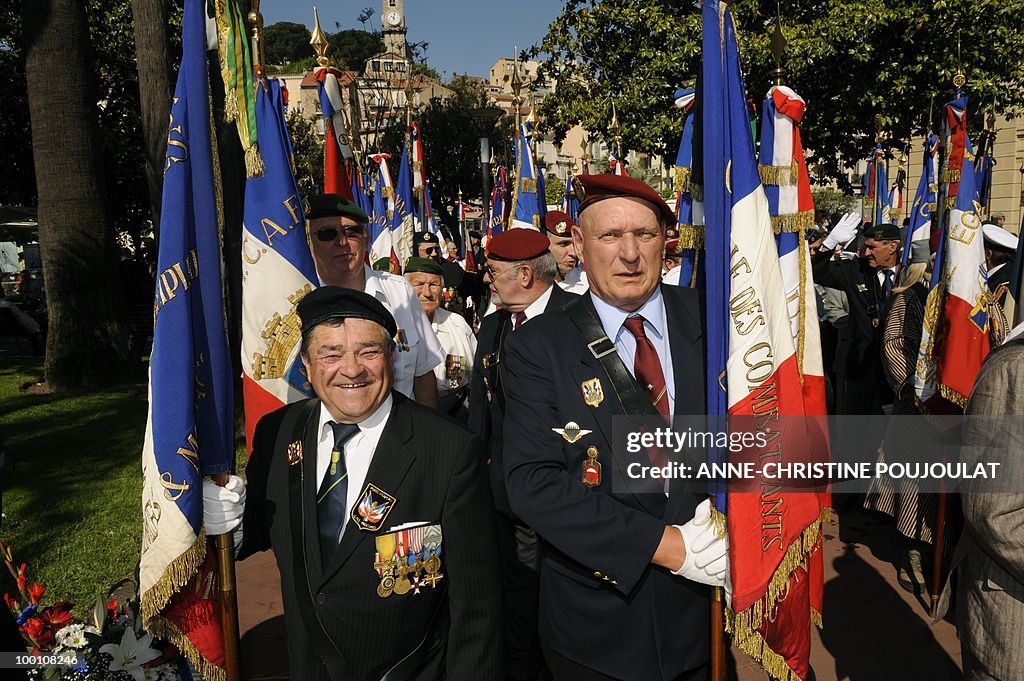 People demonstrate with French flags to