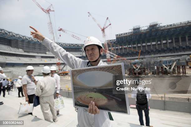 Organizer explained the progress in construction site for the Tokyo 2020 Olympic new National Stadium construction media tour on July 18, 2018 in...