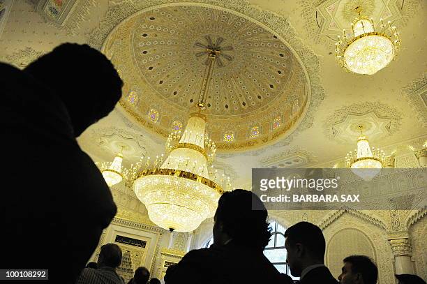 Visitors attend a service to inaugurate the new Omar Mosque in Berlin's Kreuzberg district during the inauguration of the Islamic Maschari Centre on...