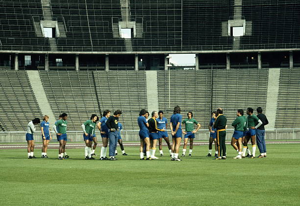 Mario Zagallo the coach for Brazil and the team trainer Admillo Chirol talking with the rest of the team in training before the start of the 1974...