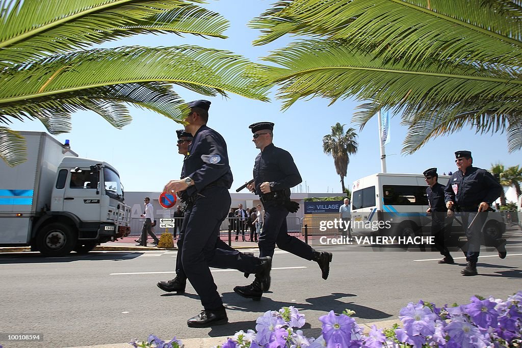 Policemen take position next to the Pala