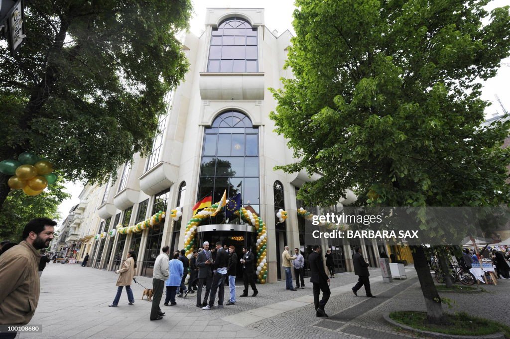 Visitors stand in front of the new Omar