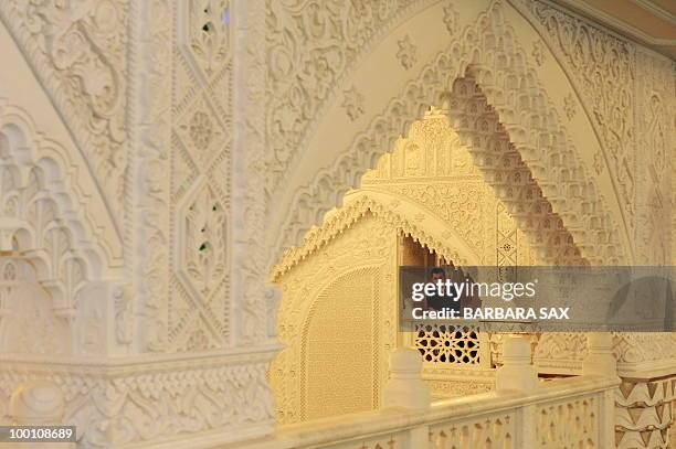 Man watches from a gallery of the new Omar Mosque in Berlin's Kreuzberg district during the inauguration of the Islamic Maschari Centre on May 21,...