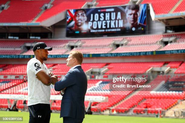 Anthony Joshua goes head to head with Alexander Povetkin during a press conference at Wembley Stadium on July 18, 2018 in London, England.