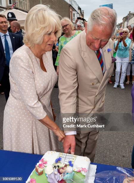 Prince Charles, Prince of Wales and Camilla, Duchess of Cornwall visit Honiton, and attend the town's 'Gate-to-Plate' food market, meeting residents...