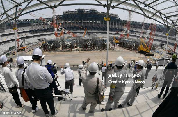 Members of the media are given a tour of Japan's new National Stadium, the main venue of the 2020 Tokyo Olympics and Paralympics under construction...
