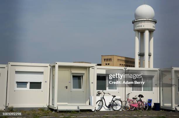 Temporary asylum seeker reception center stands at the former Tempelhof airport on July 18, 2018 in Berlin, Germany. Local politicians and advocacy...