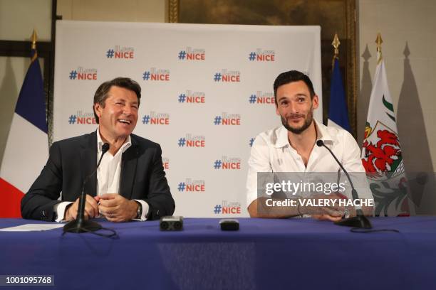 France's goalkeeper Hugo Lloris and Nice's mayor Christian Estrosi smile during a press conference in Lloris' home town of Nice, southeastern France,...