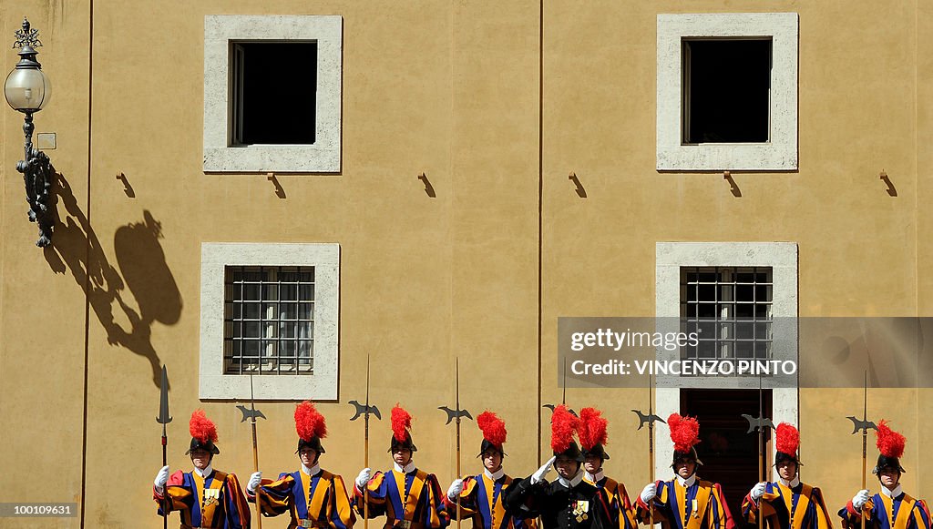 Swiss guards stand in the San Damaso cou