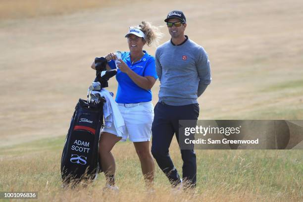 Adam Scott of Australia with his caddie Fanny Sunesson on the 14th hole during previews to the 147th Open Championship at Carnoustie Golf Club on...