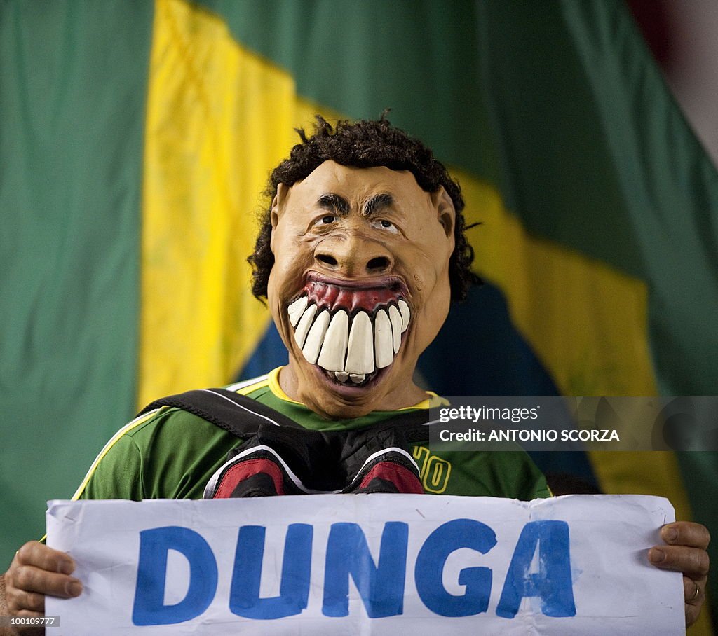 A Brazilian football fan using a mask re