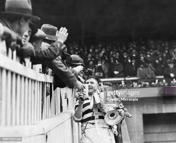 Challenge Cup Final at Wembley Stadium. Wigan 13 v Dewsbury 2. Wigan captain Jim Sullivan collects the trophy after the match, 4th May 1929.