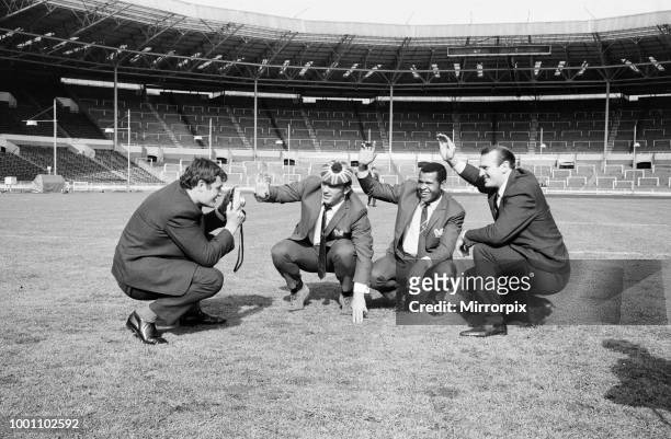Salford Red Devils rugby league team members inspect the pitch at Wembley Stadium ahead of their Challenge Cup Final match against Castleford....