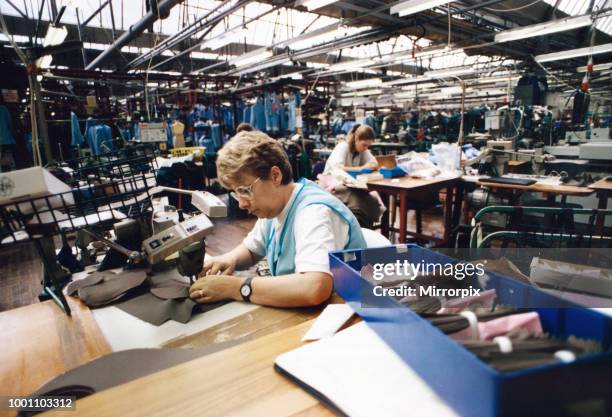 Worker Pat Evans of Alexon textiles factory at Alexon House in Hawthorn, Pontypridd. Here she is pictured sewing packets using a sewing machine....